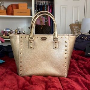 Gold Michael Kors, only used it twice. Grate conditions.